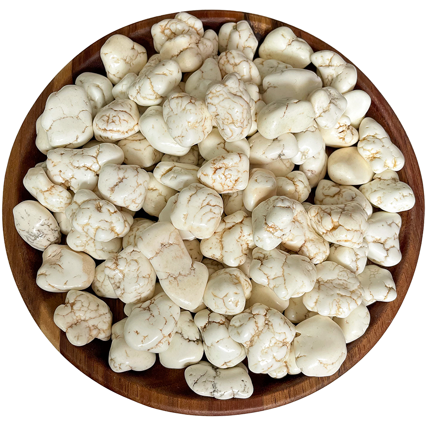 A collection of magnesite stones on a wood plate.