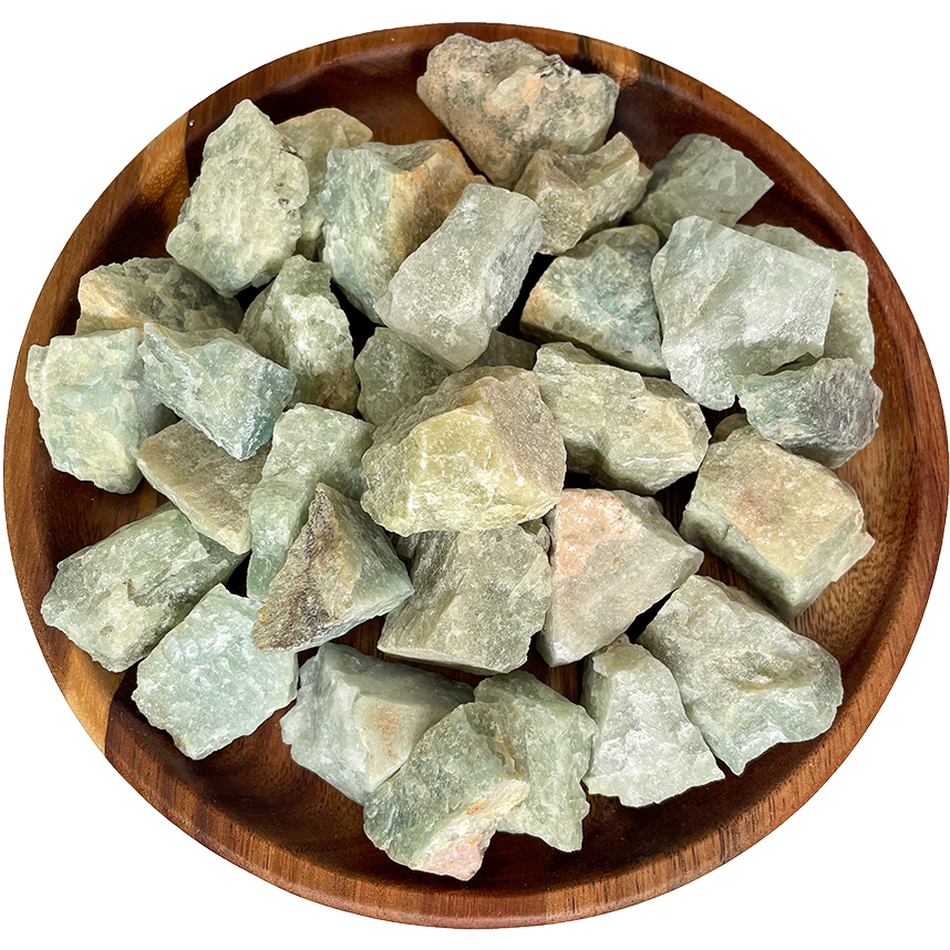 A collection of rough aquamarine stones.