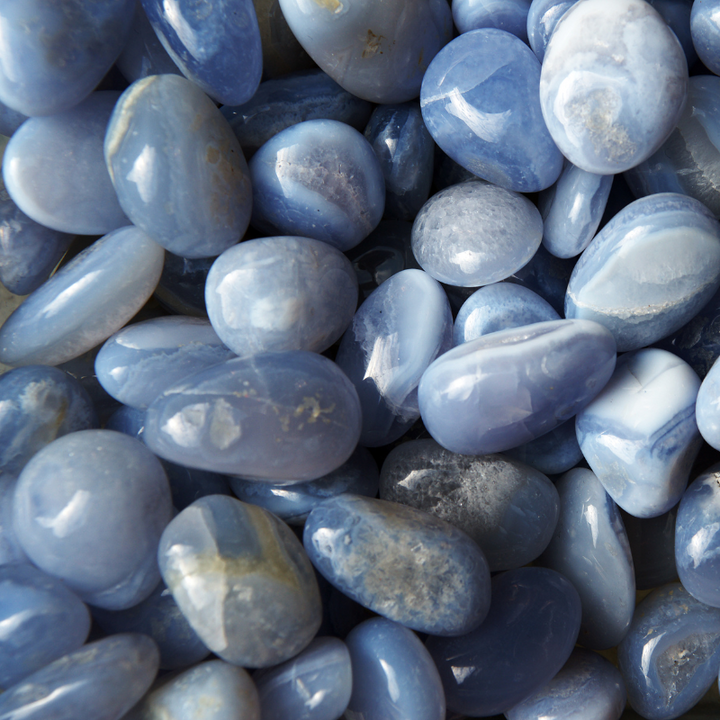 A pile of many pieces of tumbled blue Calcedony